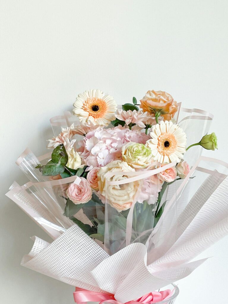 Bouquet of Roses and Gerberas on a White Background